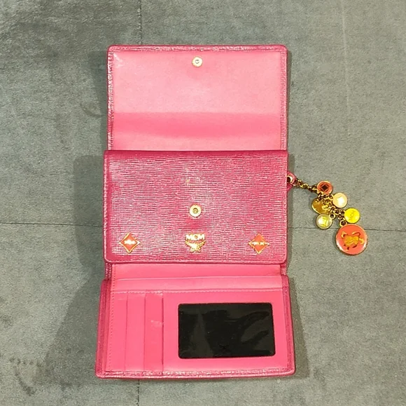 EUC MCM SAFFIANO LEATHER COMPACT WALLET DECORATIVE METAL MCM BAGDES & CHARMS